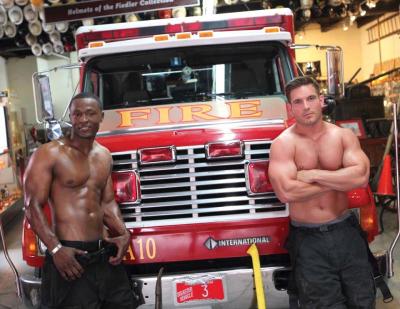 Firefighters Alector Tavares (left) and Michael Kelly pose on the back of the 2016 Boston Firefighters Burn Foundation calendar. 	CJC Photography